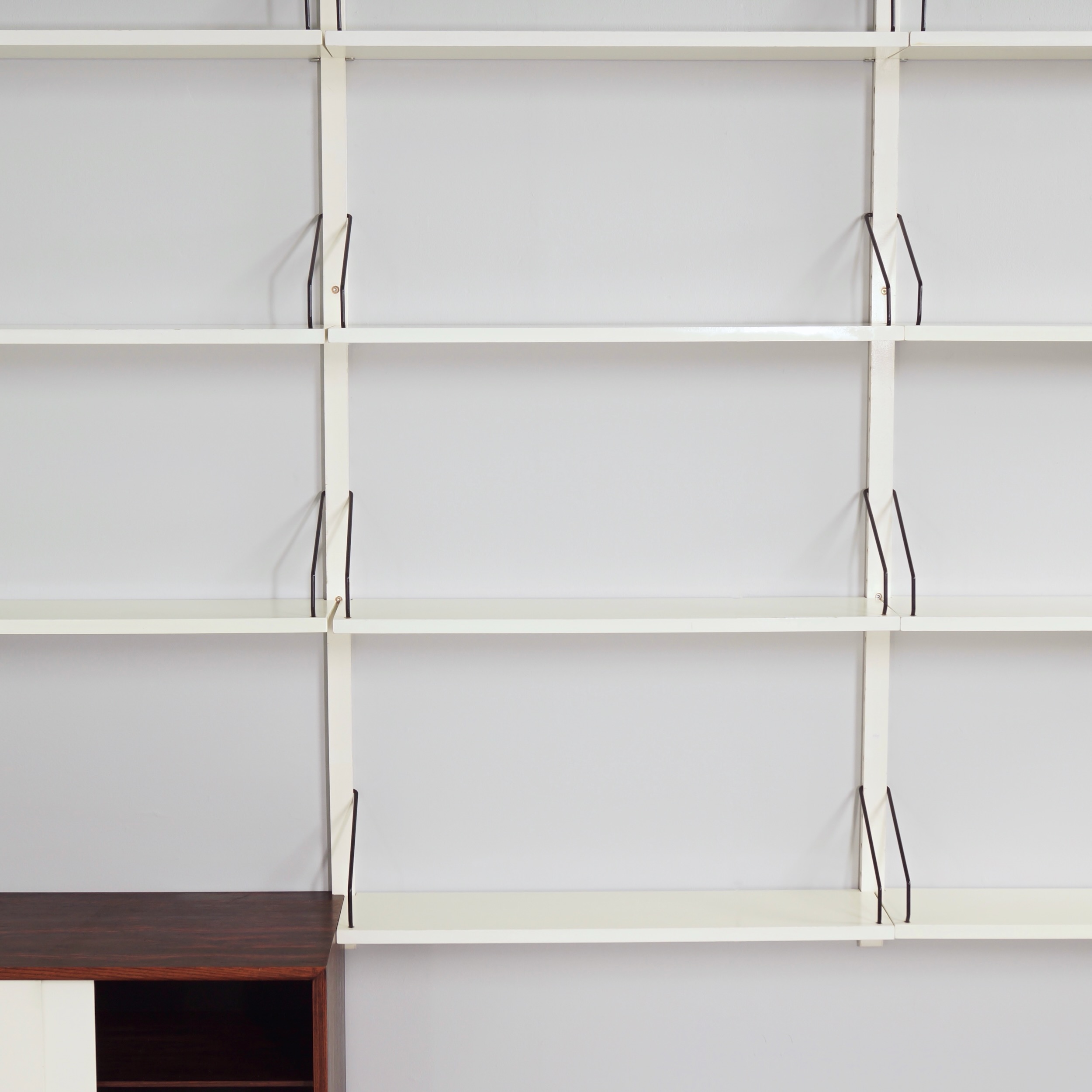 Royal System Wall system by Poul Cadovius for Cado from the 70s in white wood and rosewood