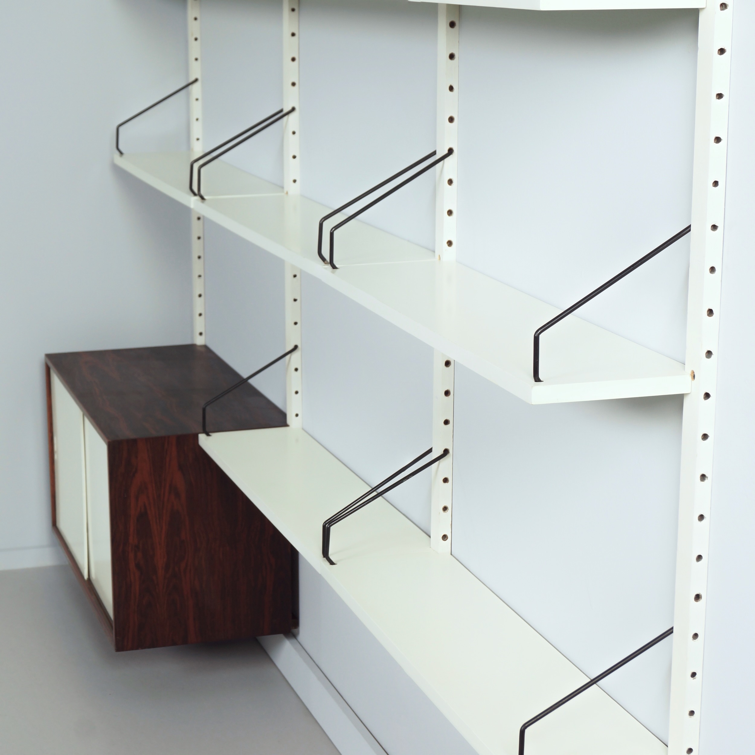 Royal System Wall system by Poul Cadovius for Cado from the 70s in white wood and rosewood
