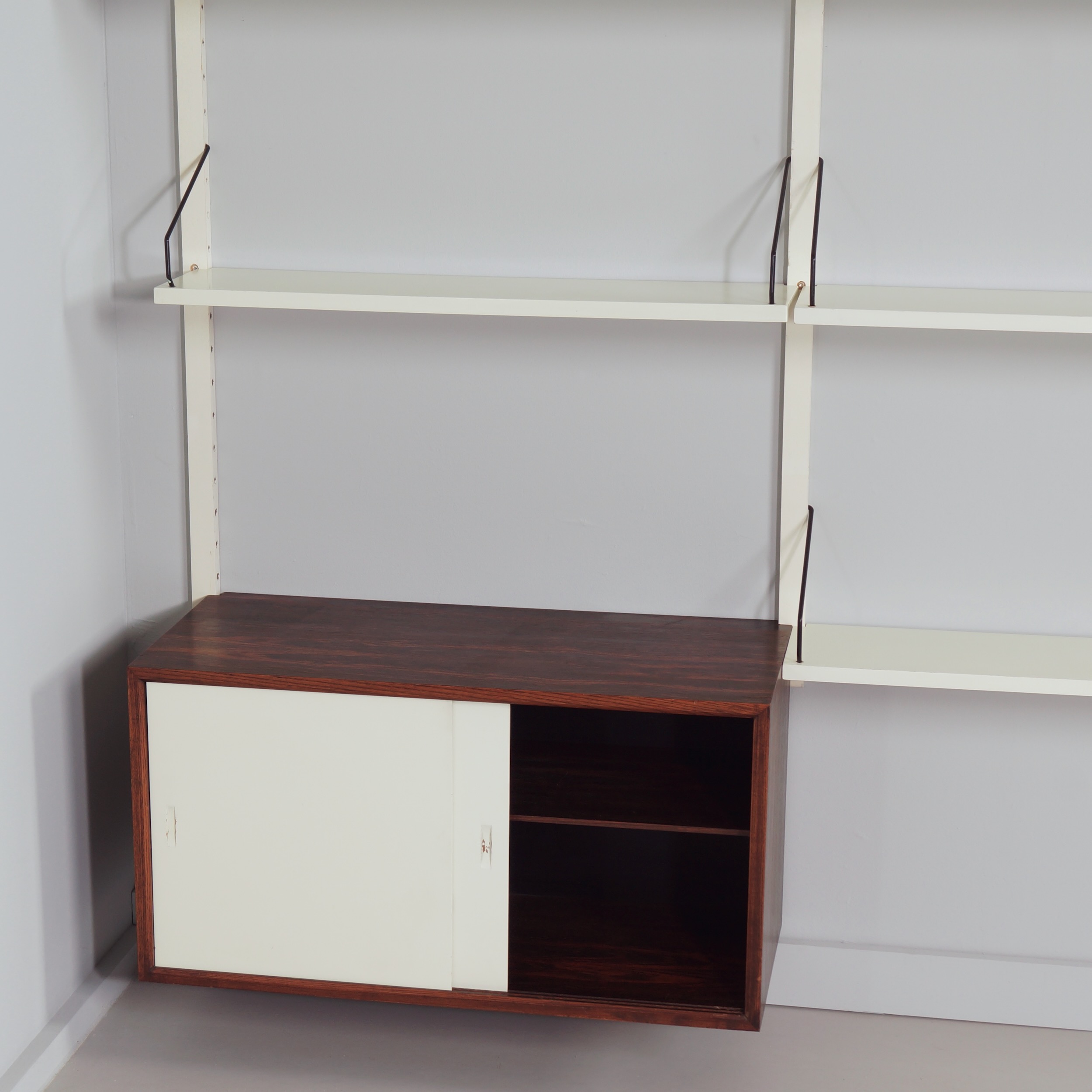 Royal System Wall system by Poul Cadovius for Cado from the 70s in white wood and rosewood