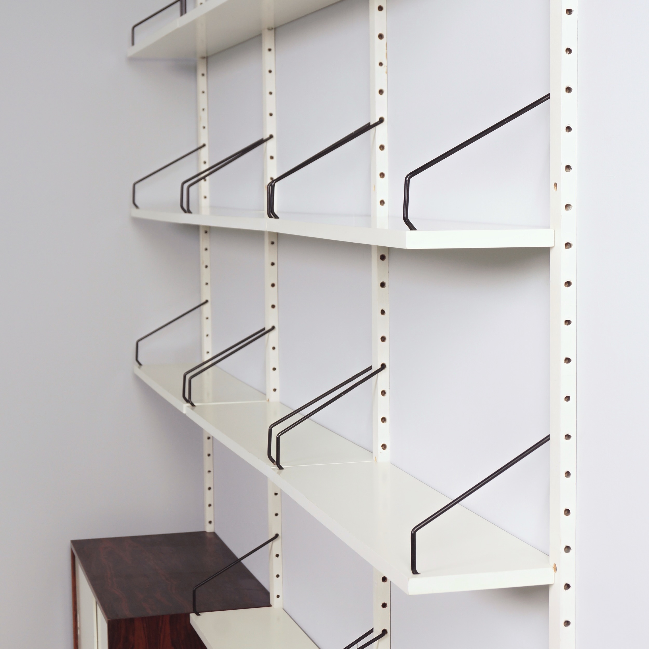 Royal System Wall system by Poul Cadovius for Cado from the 70s in white wood and rosewood