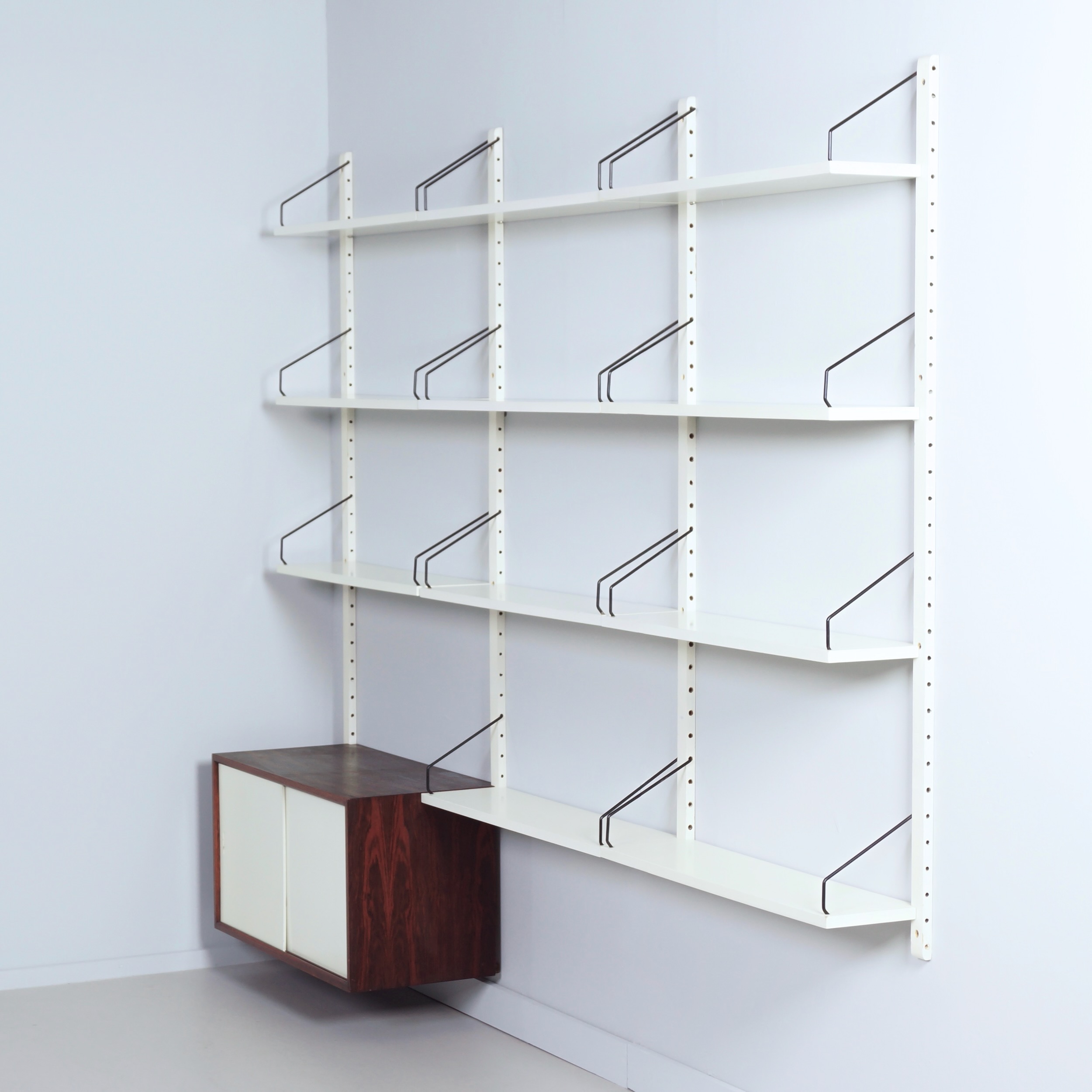 Royal System Wall system by Poul Cadovius for Cado from the 70s in white wood and rosewood
