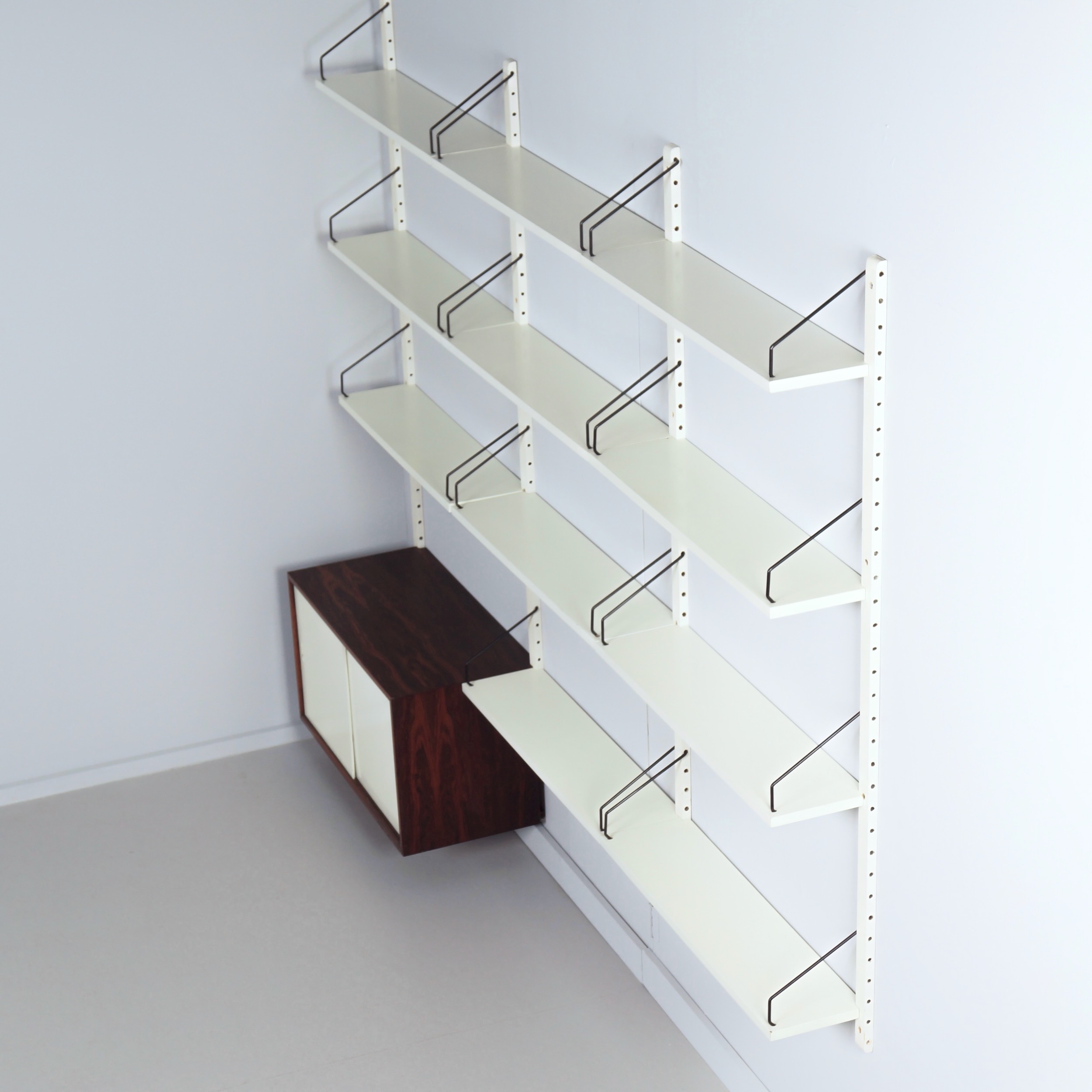 Royal System Wall system by Poul Cadovius for Cado from the 70s in white wood and rosewood